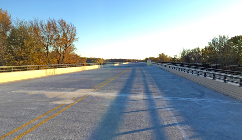 On the M-231 Grand River bridge facing southerly.