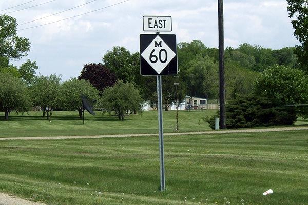 Larger M-60 signs southwest of Three Rivers.
