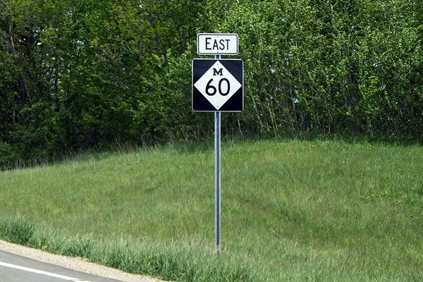 Larger M-60 signs southwest of Three Rivers.