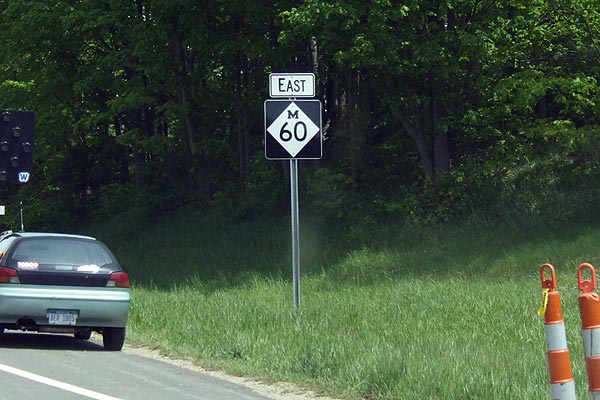 Larger M-60 signs southwest of Three Rivers.