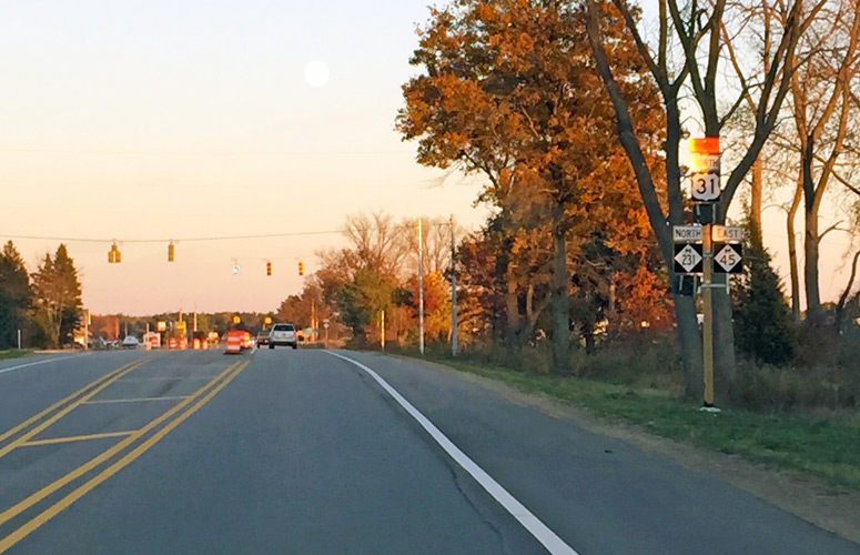 ooking westerly along M-45/Lake Michigan Dr at unopened M-231.