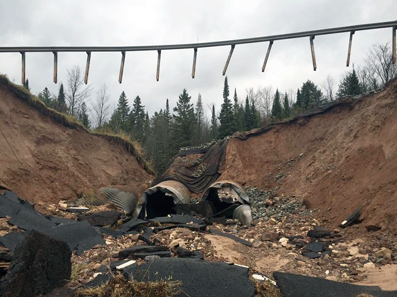 The aftermath of a flooding event on the East Branch of the Chocolay River washing away a 90-foot section of M-94.