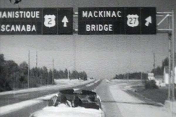 A closer view of the sign from the previous image. In the late-1950s, it seems large, overhead signs such as these were constructed in "pieces." Each letter seems to be a separate component, while the route marker section and the arrow are other sections. (June 1957)
