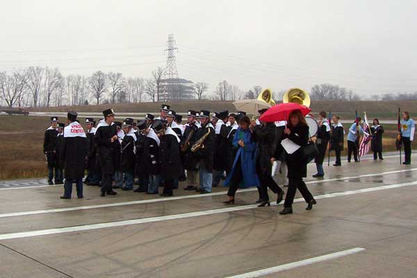 The Byron Center High School band getting queued up to play in the westbound lanes. In addition to other tunes, the band began the festivities by playing the National Anthem. The new Metropolitan Hospital structure can be seen rising in the background. 