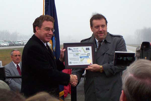 John J. Crawford, President & CEO of the Wyoming-Kentwood Area Chamber of Commerce spoke momentarily before presenting a plaque from the Chamber to Roger Safford thanking the department and its workers for their hard work on the freeway. 